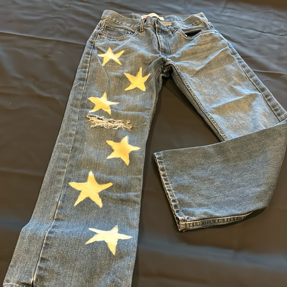Levi’s 505 regular with stars on leg.